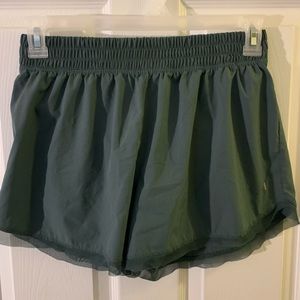 Athletic shorts with mesh bottom